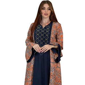 Elegant ethnic two-piece set with orange geometric cardigan and navy sequined dress