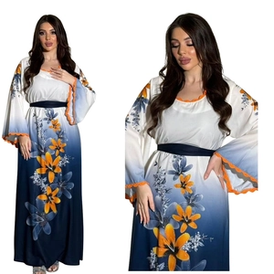 Detailed orange lace edge on floral kaftan with blue gradient print and rhinestone accents