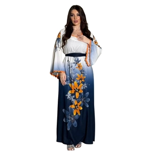 Close-up detail of gradient blue floral kaftan with orange lace trim and sequin accents