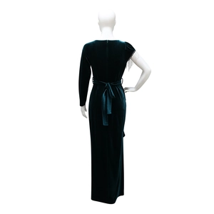 Detail of dark green velvet evening dress featuring shimmering silver chain fringe on the cuff
