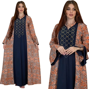 Detailed close-up showing the ethnic geometric print and rhinestone accents on this kaftan