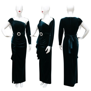 Detailed view of dark green velvet slim dress with asymmetrical shoulder and chain fringe