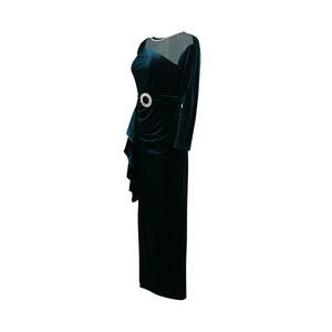 Detail of emerald velvet gown showing mesh neckline and rhinestone buckle with side ruffles