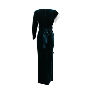 Detail view of the back of a slim-fit velvet evening gown with silver fringe shoulder