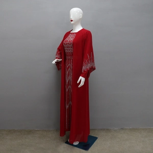 Detailed view of red chiffon abaya with silver rhinestone patterns and waist belt