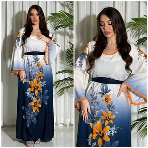Elegant long gradient blue dress with orange floral print and rhinestone accents