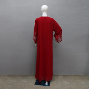 Close-up of red chiffon long robe featuring intricate silver rhinestones on the sleeve