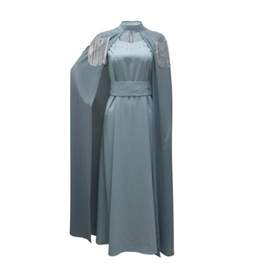 Elegant light blue long dress set with sequins, silver fringe, and matching cape