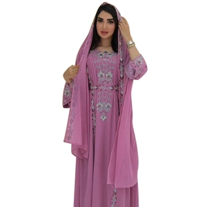 Detail of silver floral embroidery on purple Middle Eastern abaya robe with matching shawl