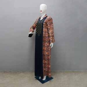 Detail view of ethnic long sleeve kaftan dress featuring geometric prints and embroidery