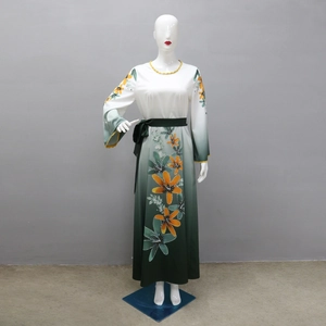 Detailed view of floral prints and green gradient pattern on the long sleeve maxi dress
