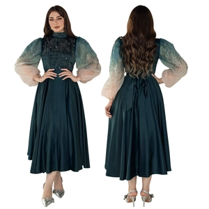 Elegant emerald green jalabiya dress with bubble sleeves and rhinestone accents