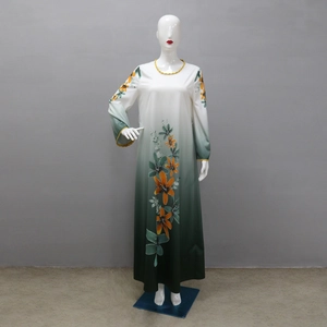 Detailed view of rhinestone floral print on white and green gradient long maxi robe dress
