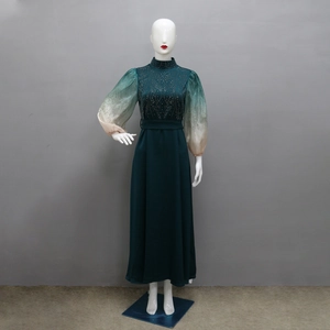 Detail of jalabiya gown featuring sparkling rhinestones and gradient bubble sleeves