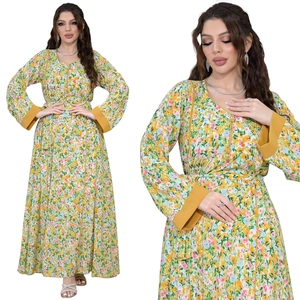 Detail view of V-neck floral maxi dress with yellow print and long sleeves finish