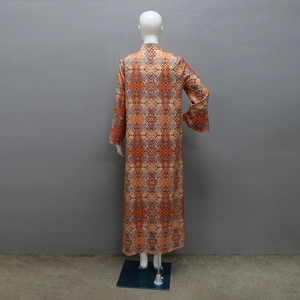 Detailed back view of an ethnic kaftan featuring vibrant geometric prints and hot-drilled rhinestones