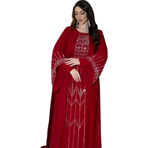 Close-up of red chiffon Abaya robe featuring intricate silver sequins and embroidery details