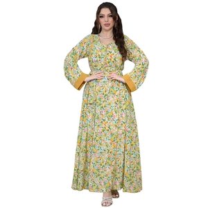 Detail of V-neck floral maxi dress with yellow cuffed long sleeves and orange pattern