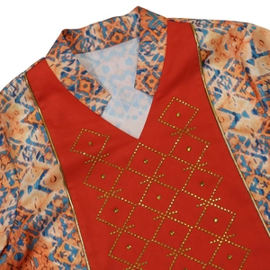 Close-up of V-neck ethnic robe featuring gold rhinestones and geometric prints