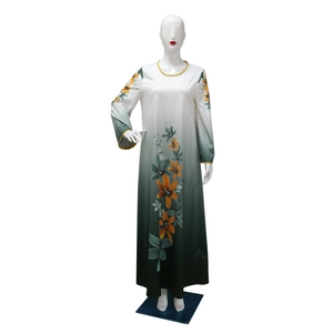 Detail of tropical floral pattern with rhinestone accents on long sleeve gradient dress