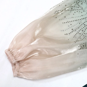 Detail of gradient jalabiya sleeve with crystal rhinestones and puffed elastic cuff