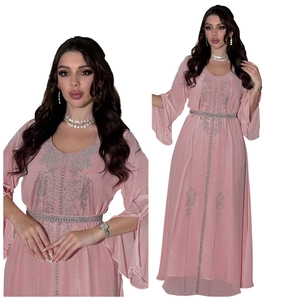 Detailed view of pink chiffon kaftan dress featuring silver sequins and elegant bell sleeves