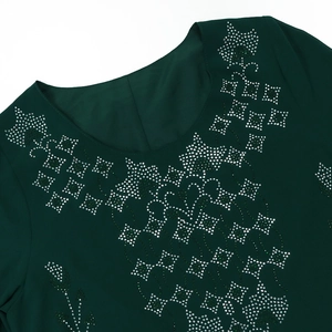 Detail of rhinestone neckline patterns on a dark green summer robe dress for women