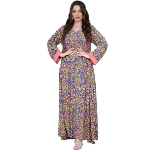 Detail of floral maxi dress showing long sleeves with contrasting pink patchwork cuffs
