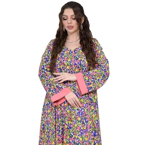 Detailed close-up of blue floral maxi dress with pink contrast neck and sleeve trim