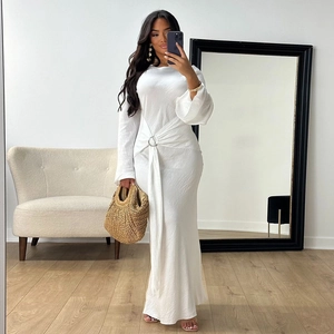 Close-up of elegant white floor-length dress with silver ring buckle waist detail