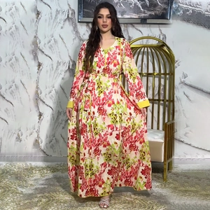 Detailed view of floral long dress featuring yellow trim accents and soft chiffon fabric
