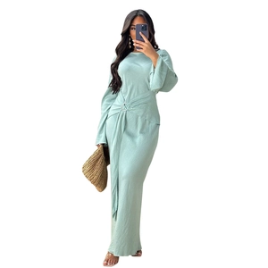 Elegant mint green long sleeve maxi dress with silver ring waist detail and pleated texture