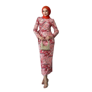 Detail of red paisley print maxi dress with waist tie and matching hijab