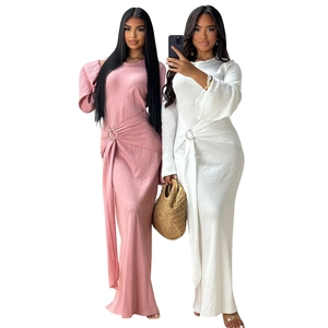Detailed view of long sleeve elegant gowns with metal ring waist and pleated ribbon drape
