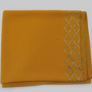 Detail of yellow chiffon robe scarf with silver rhinestone diamond grid patterns