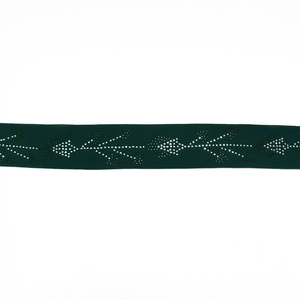 Close-up of green velvet robe belt with intricate silver and green rhinestone leaf patterns