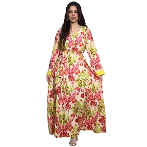 Detail of floral maxi dress showing long sleeves with yellow cuffs and high waist tie design