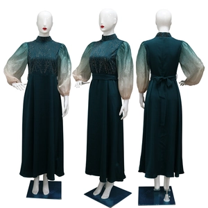 Three-way view of a dark green jalabiya dress with gradient lantern sleeves and rhinestones
