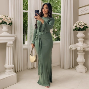 Detail of elegant sage green maxi dress featuring waist metal ring and draped fabric folds
