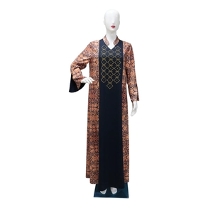 Detail of geometric ethnic prints and rhinestones on the sleeve and side of the blue abaya
