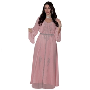Close-up of pink chiffon maxi dress with silver sequins and elegant flare sleeves