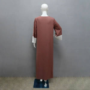 Back view of a modest long-sleeved abaya dress with contrasting white spliced cuffs