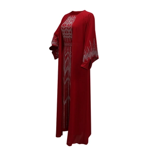 Detailed view of silver rhinestone geometric patterns on deep red chiffon robe and cardigan