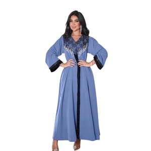 Detail view of the intricate black lace embroidery and sequins on this blue velvet Abaya dress