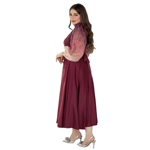 Detail of burgundy jalabiya dress with gradient puff sleeves and rhinestone accents