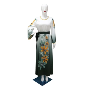 Detailed view of women's long robe featuring vibrant orange floral prints and green gradient