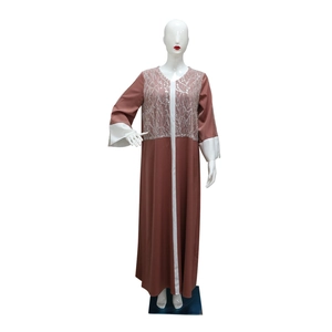 Close-up of silver sequin embroidery on satin abaya with contrast white panels