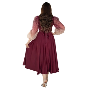 Detail view of burgundy jalabiya gown with sequined gradient puff sleeves and back bow tie