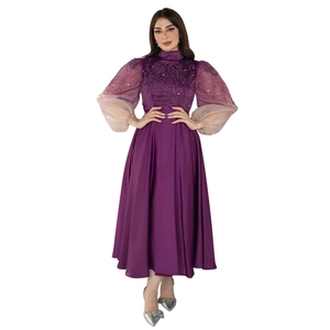 Detail of sequin bodice and purple translucent puff sleeves on gradient jalabiya gown