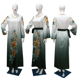 Detail view of floral print abaya with rhinestone accents and green gradient design